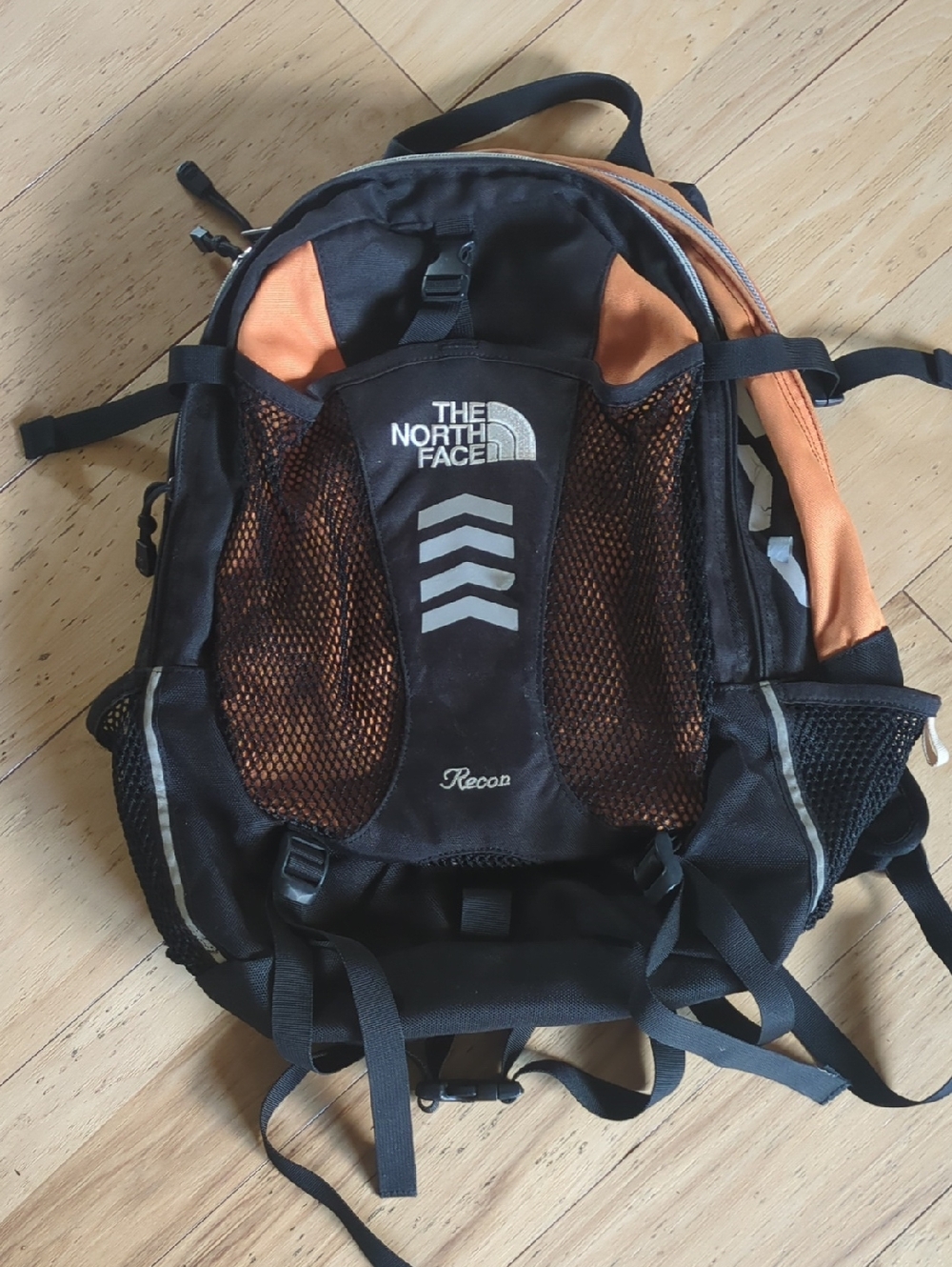 The North Face Recon Backpack in black and orange